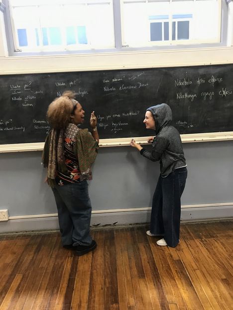 Students practising at the chalkboard