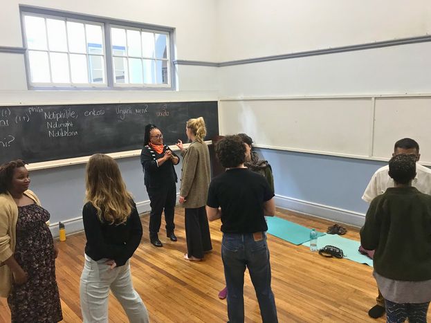 An isiXhosa class standing together in a classroom